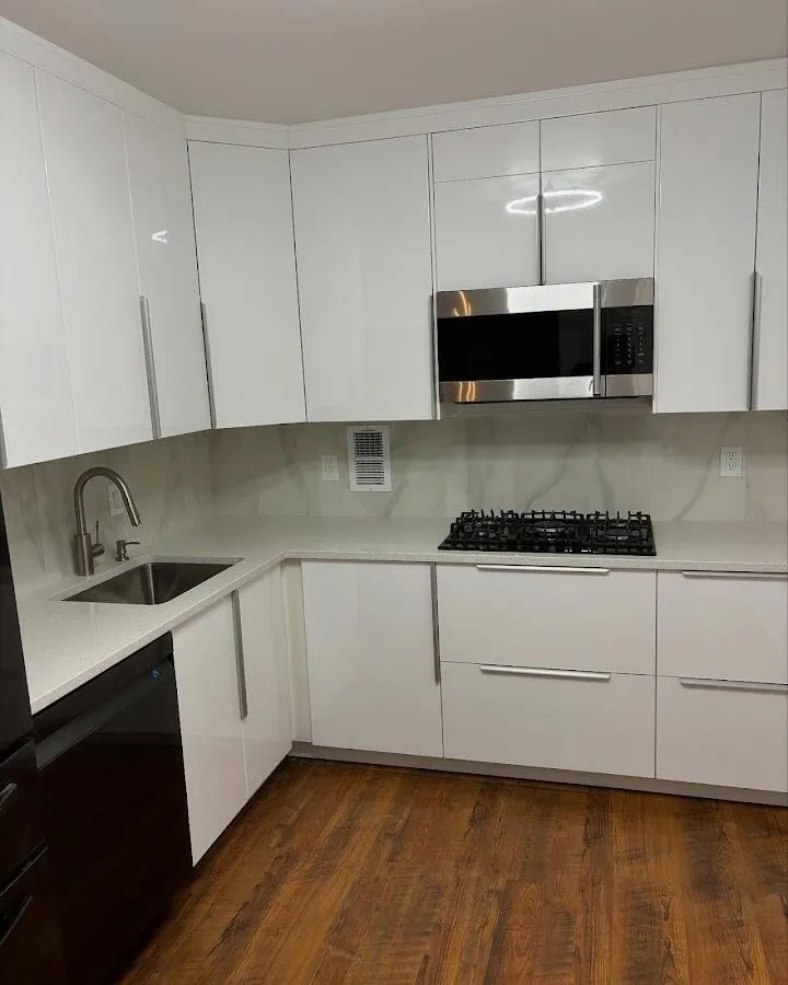 Restored kitchen with white cabinets after water damage in Manchester
